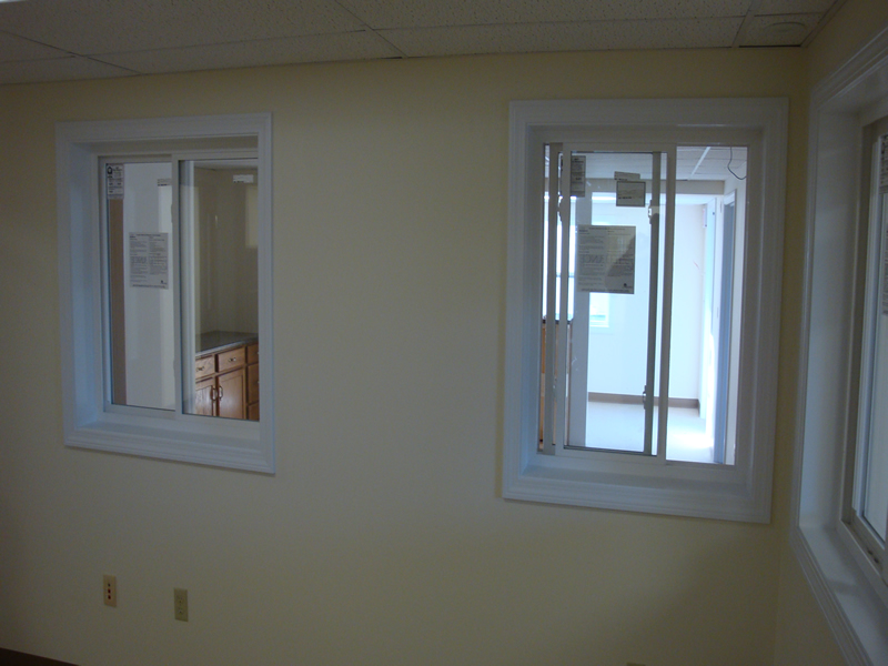 Office with interior windows.  Office walls painted by Restoration Jones.