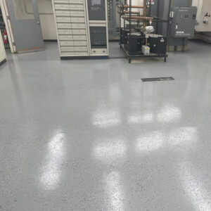 Commercial space with gray speckled floor.