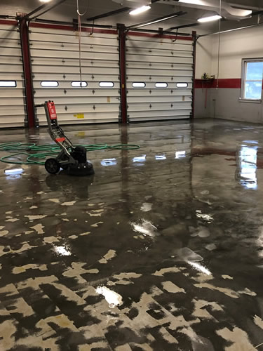 Commercial garage floor in the process of being finished.