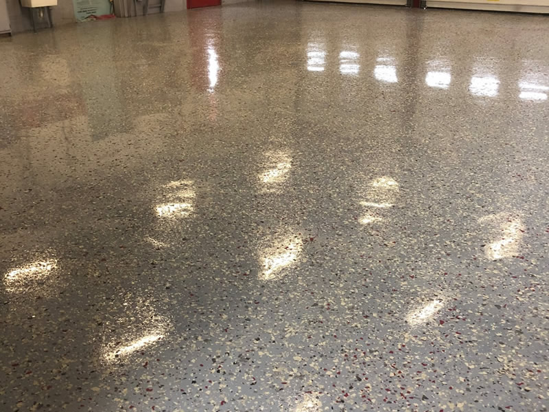 Finished garage floor in gray with multi-colored speckles