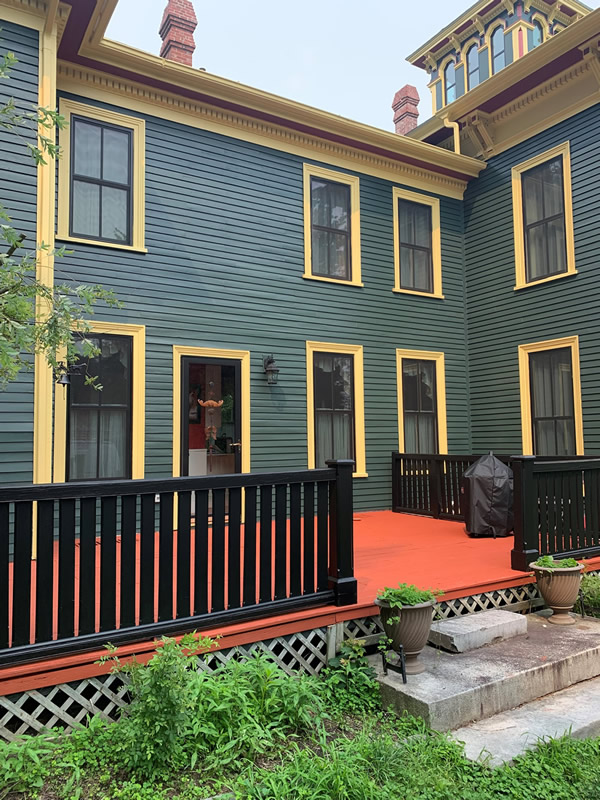 Historic home with widow's walk and stained deck.