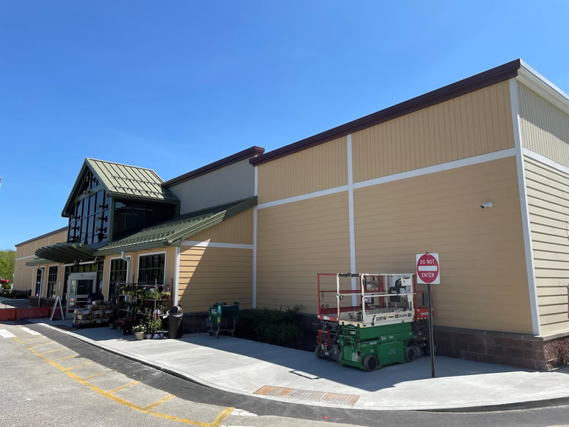 Completed exterior commercial painting of Hannaford's grocery store.